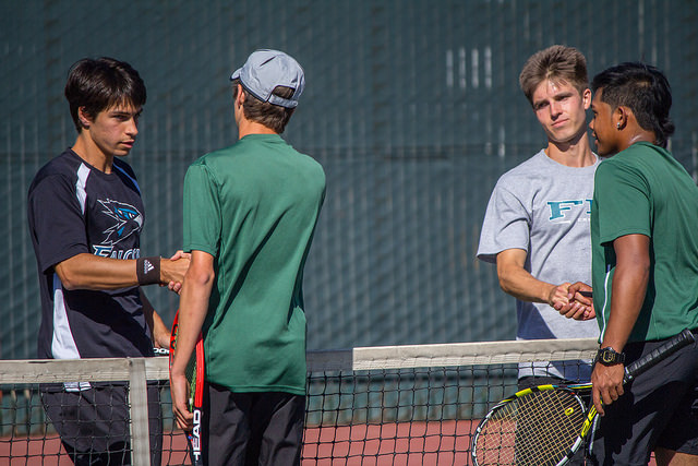 Sean Austin Miller 19 Business Major (Left) and Vaughn Asuncion 19 Kinesiology Major (Right) Shaking Hands with Their Opponents After Their Tennis Match on February 27th, 2015 in DVC Pleasant Hill Campus.