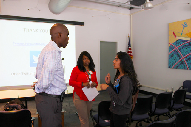 Ria Sharma, 19, Education major asking some advice from speaker Tyrone Howard at his presentation on Wednesday March 18.