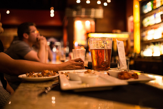 Beer and buffalo wings at the bar at BJs Restaurant and Brewhouse in Pleasant Hill, California on Tuesday, May 5, 2015.