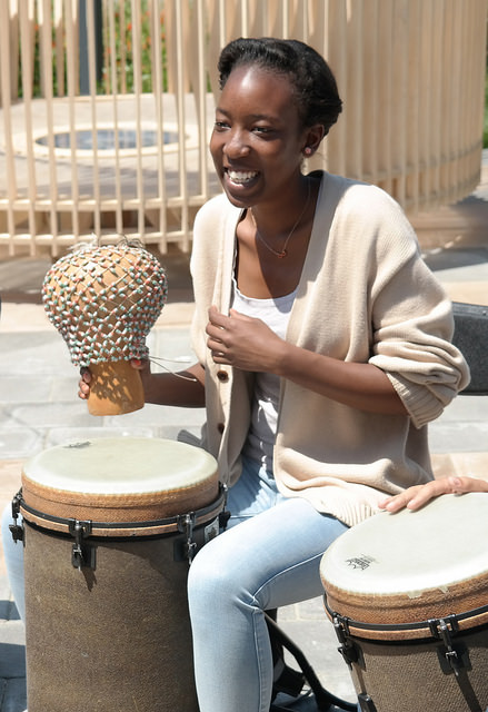Pan African Union President Emily Ajwang, 24, joins in the drum circle at DVCs Earth Day celebration on April 22.