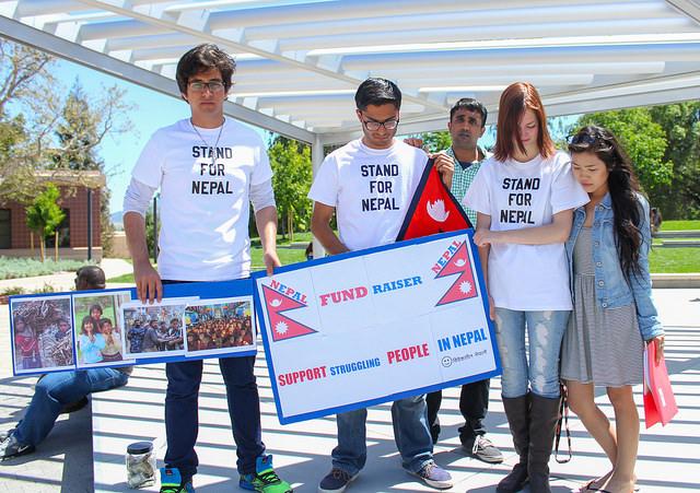 Sasmit Pokharel, 19,  (second from left) and his friends stand on the DVC Commons Area stage on April 27, 2015. The students gathered to raise awareness and funds for victims of the recent earthquake in Nepal.