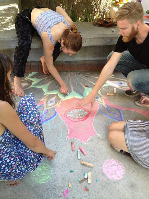 DVC art students drawing a mandala in the art quad on April 30 for the Student Art Awards BBQ.