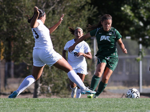 DVC midfielder Icela Rodriguez (12) evades defenders as she moves down the field in the second half of the game.