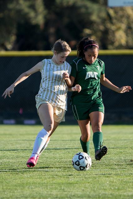 DVC forward Karla Ramos (7) and SJD midfielder Elizabeth Martinez (13) battle for the ball in a game between DVC and SJD at DVC in Pleasant Hill, Calif. on Friday, Oct. 16, 2015. The Vikings tied 2-2.