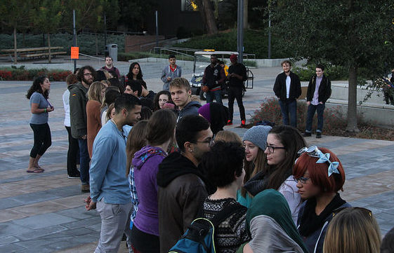 Students participate in a step up, step back  activity lead by a key speaker during the Womens Empowerment DVC Take Back the Night Rally in the DVC quad, Nov. 4.