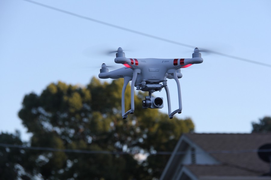 The new line of consumer drones by DJI Phantom hovers over Martinez on November 7th during a test flight.