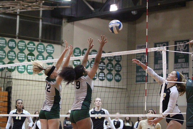 DVC Vikings Madison Hatch and Cailey Rocquemore try to block a spike from a San Joaquin outside hitter at the DVC vs San Joaquin Delta game in Pleasant Hill, Nov. 11, 2015.