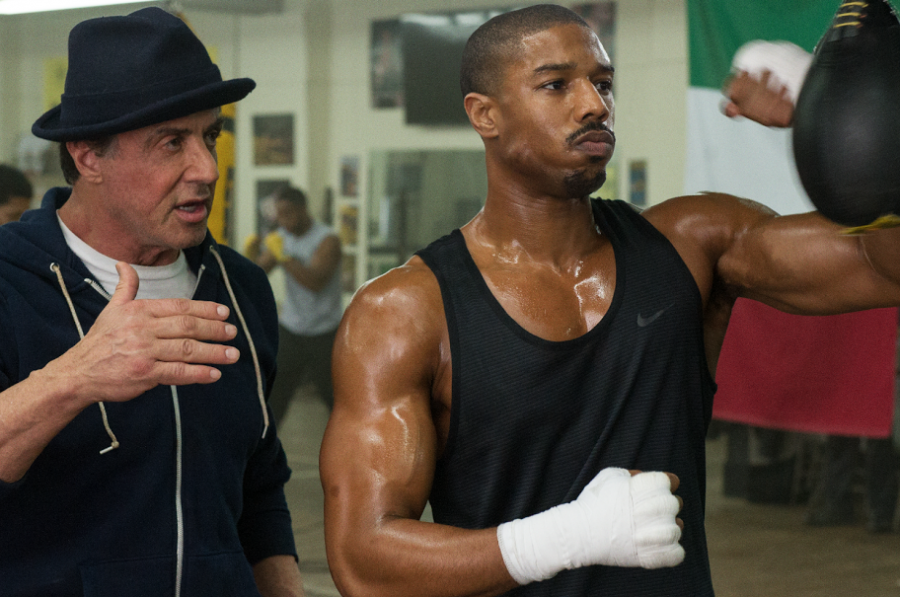 Sylvester Stallone as Rocky Balboa (left) trains Michael B. Jordan as Adonis Creed (right) in the new film Creed.