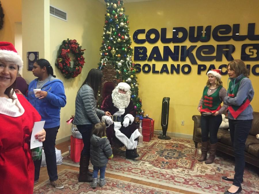 Santa Clause comes to Coldwell Banker in Benicia to listen to what all the children want for Christmas this year. 