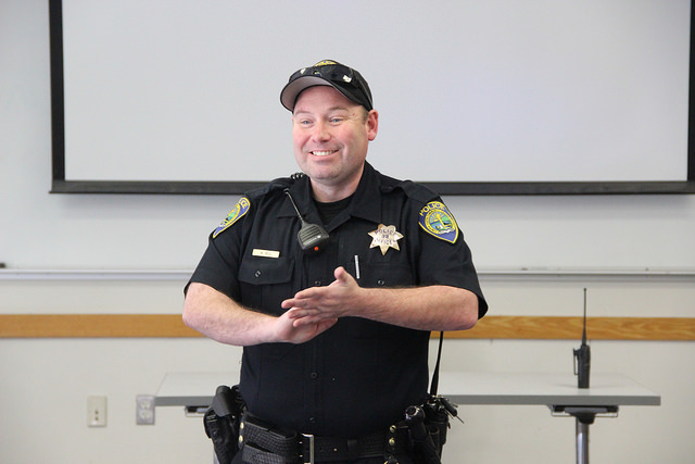 Campus Police Officer W. Bell addresses students at the Cop Coffee Brown Bag Workshop in the DVC Student Union, Feb. 4