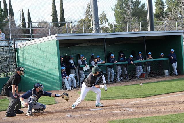 Zachary Guardino lays down a sacrifice bunt against Mendocino College.