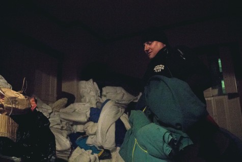 Doug Stewart from the Contra Costa County Homeless Outreach gathers up blankets, clothes and tarps from his HQ in Martinez before heading out to North Richmond on 5 March.