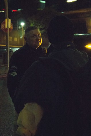 Doug Stewart from the Contra Costa County Homeless Outrach Program checks in with a homeless man and gives him some food and blankets at the Concord Bart station in Concord on 5 March.