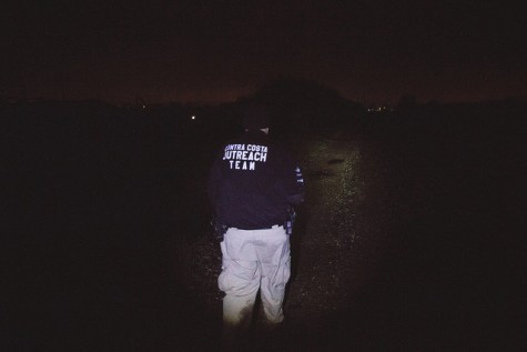 Doug Stewart from the Contra Costa County Homeless Outrach Program hikes down the train tracks to find homeless camps that may have been washed out by the rain or are in need of assistance in North Richmond on 5 March.