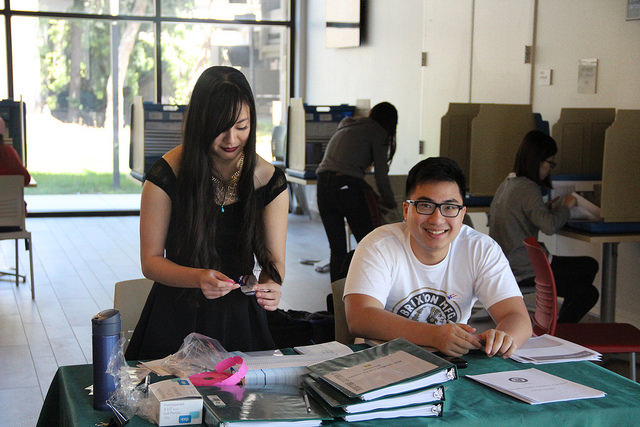 Wesley Xia and Ashley Leung, both ASDVC members sit at the polling booth during the elections April 13.