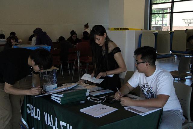 From left, Xiajun Kokun Yang, Ashley Leung and Wesley Xia at the ASDVC voting booths