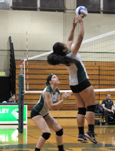 Outside hitter Daisy Manoa and middle hitter Ashley Dixon playing against Folsom Lake College Friday Oct. 14