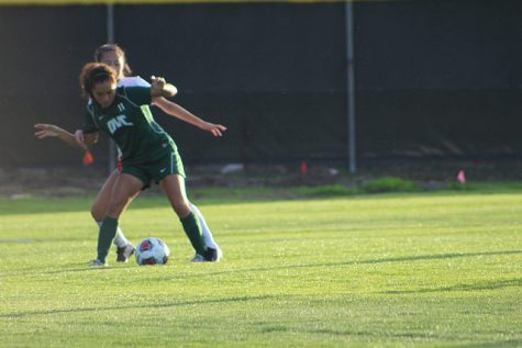 Karla Ramos fends off ARC defender.