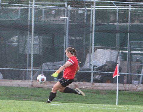 Goalkeeper Katie McLaughlin kicks the ball.