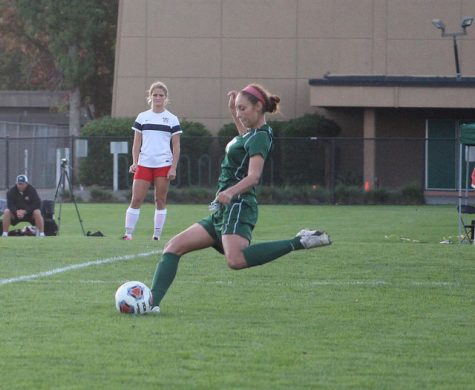 Jessica Jaime kicks the ball towards the net.