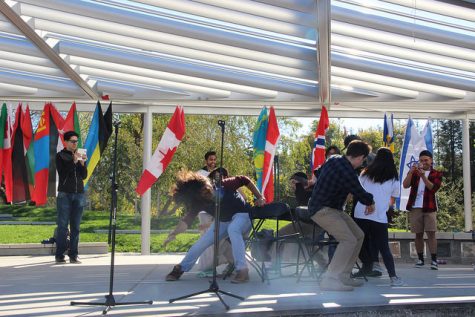 Members of International Students Club and student volunteers in action playing musical chairs to songs from around the world, Thursday, Nov. 17, 2016 in the DVC Quad.