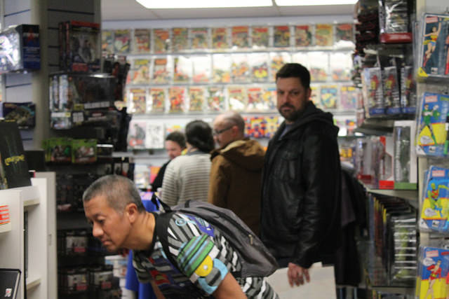 A line forms during a signing at Flying Colors Comic Book store on November 19, 2016.