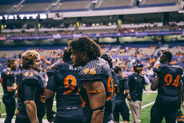 Franklin Uesi taking a break from play during a stoppage in the game. 