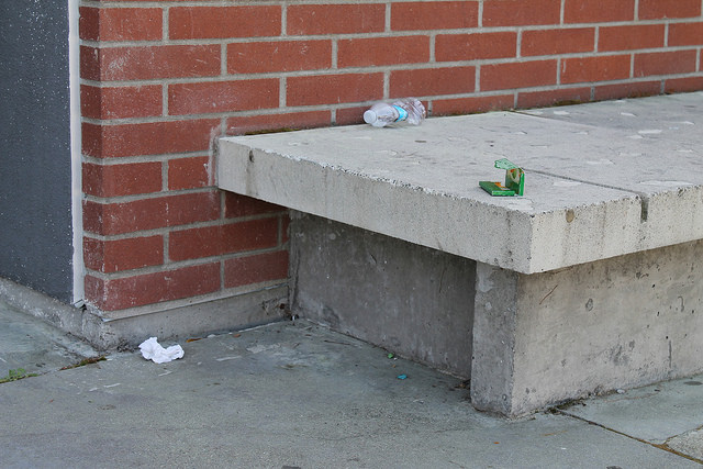 Trash left in the sitting area near the Life and Health Science building.