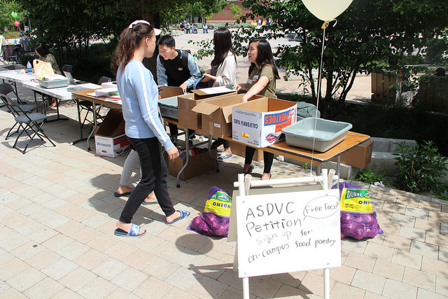 Karen Suryajaya and Asami Higuchi of the ASDVC food pantry ad hoc committee gathering signatures at the Spring Festival Apr. 19, 2017.