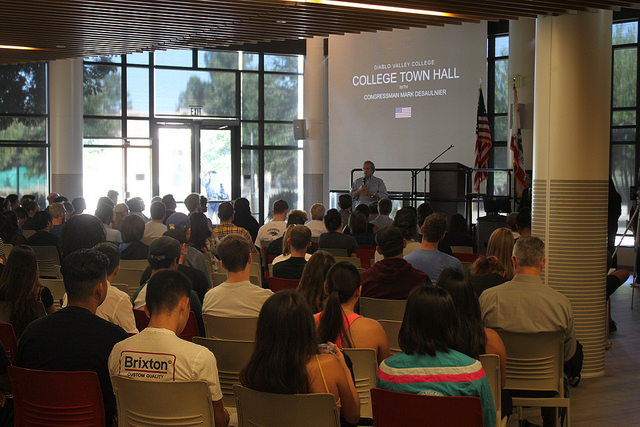 Congressman Mark DeSaulnier replies to questions in the packed out cafeteria.