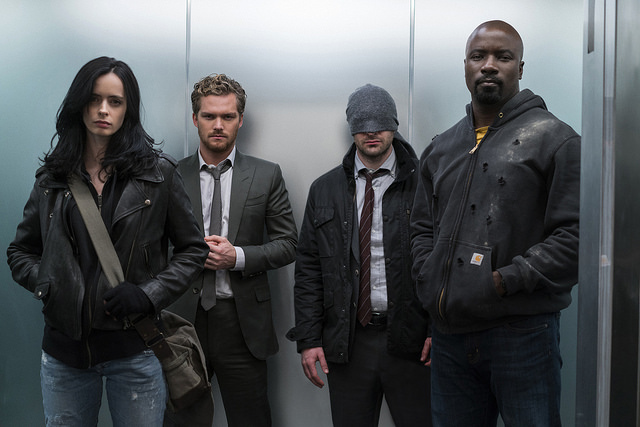 Jessica Jones (Krysten Ritter), Iron Fist (Finn Jones), Daredevil (Charlie Cox), and Luke Cage (Mike Colter) as Marvels Defenders, available now on Netflix. 