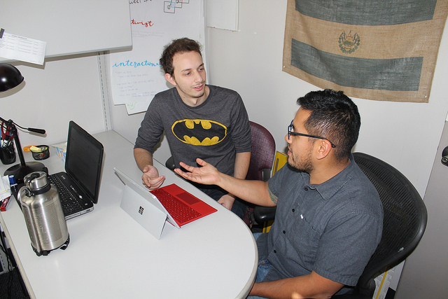 Kelvyn Moran and Kion Karimi work through an issue with a Microsoft Surface Pro 3 in the Learning Center. (staged stock photo) photo by Danny Yoeono