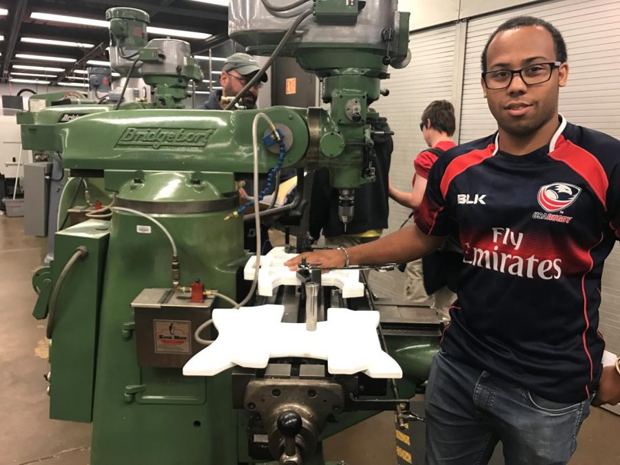 Business major Gerald Sanchez, 20, stands near a mill in the DVC machine shop on Tuesday, Oct. 17th. Students in the new ROV club will design and fabricate remotely operated underwater vehicles for competition.