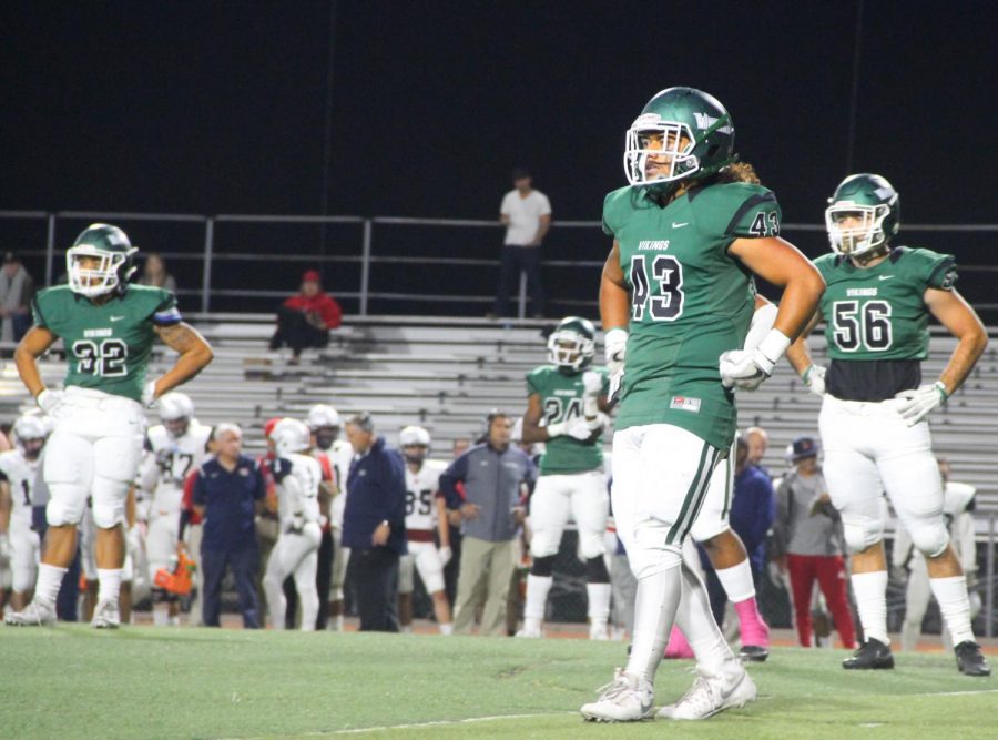 Viking defenders look up to their coach to call the next play during a game against Santa Rosa College at Viking Stadium in Pleasant Hill, California on October 27, 2017.