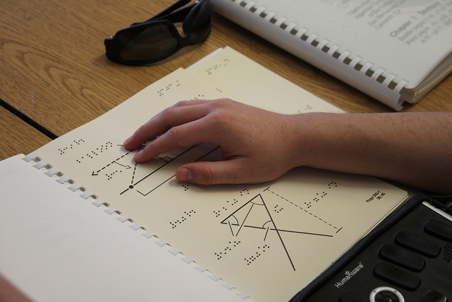 Kevin does his Trigonometry homework via brail