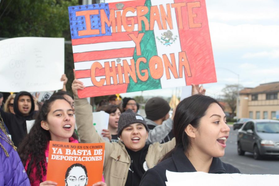 DVC Students Nayely Jauregui (Middle) and Celeste Rios (Left) march along Monument Blvd with other protesters to speak out against the recent ICE raids throughout Bay Area communities.