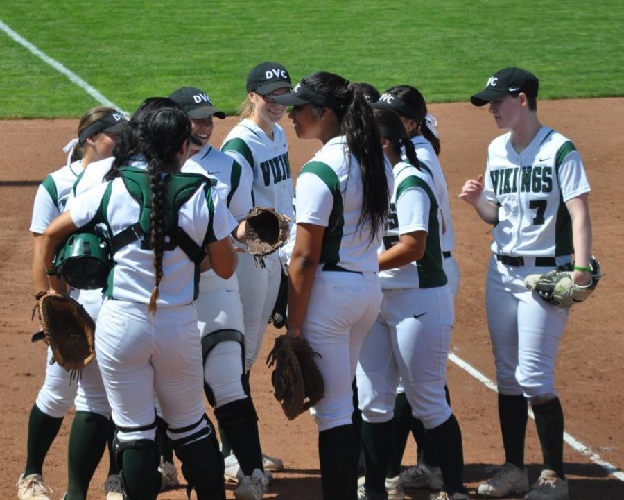 DVC softball gathers together before a game against Sacramento City in Pleasant Hill on March 31, 2018.