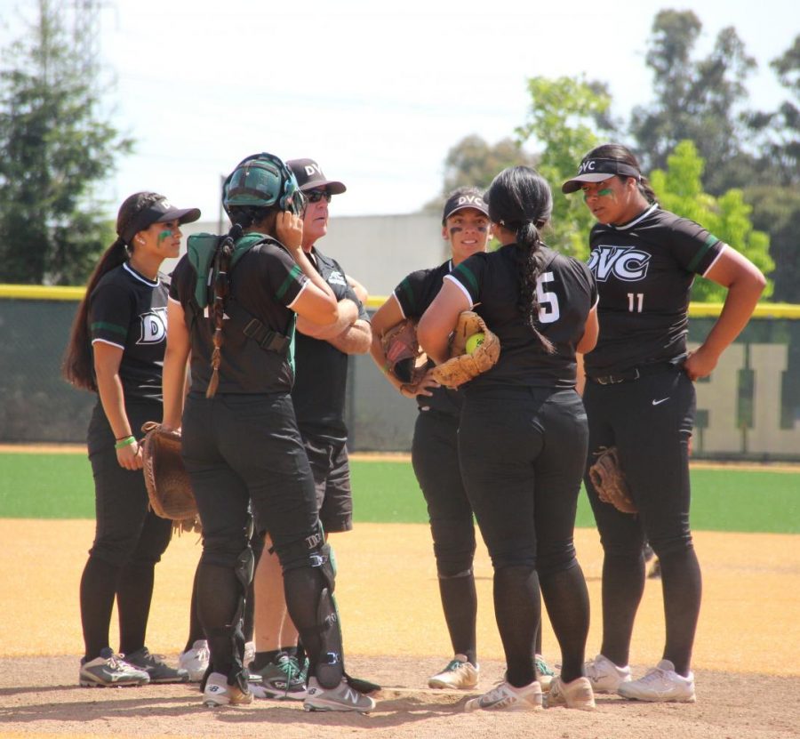 Vikings have a mound visit during their playoff game against Ohlone College in Fremont on May 4, 2018.