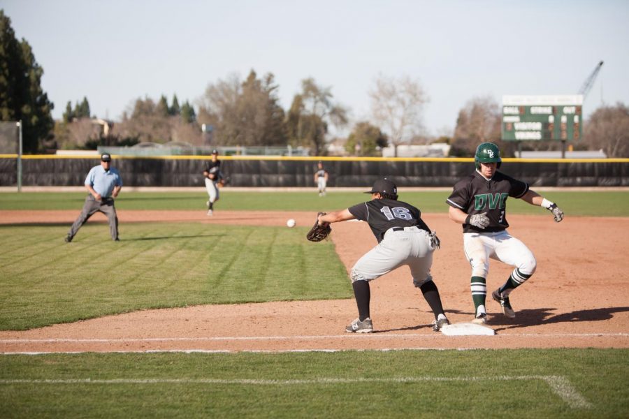Jake Villa narrowly makes it back to first base just before Andrew Mallon catches the ball at DVCs game against Mission College on Feb. 12, 2015.