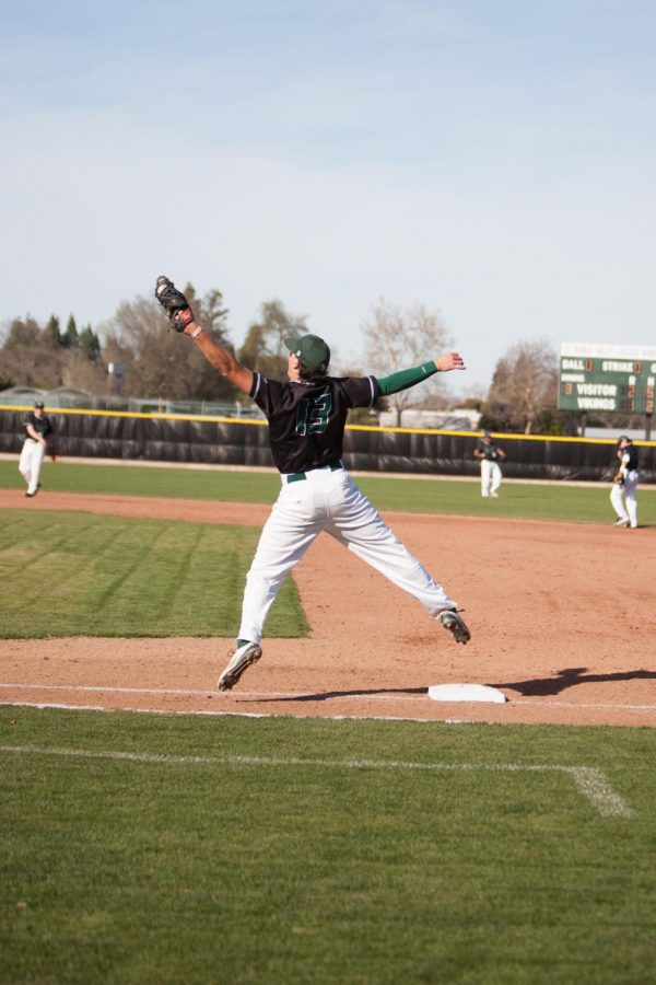 First baseman Leo Costa jumps to catch the ball at DVCs game against Mission College on Feb. 12, 2015. The Vikings won 4-3.