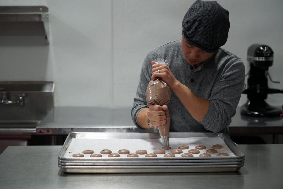 Evan B. Lowe, owner of PaperBox Bread & Pastry prepares his personal recipe for macarons. (Ethan Anderson/The Inquirer).                            