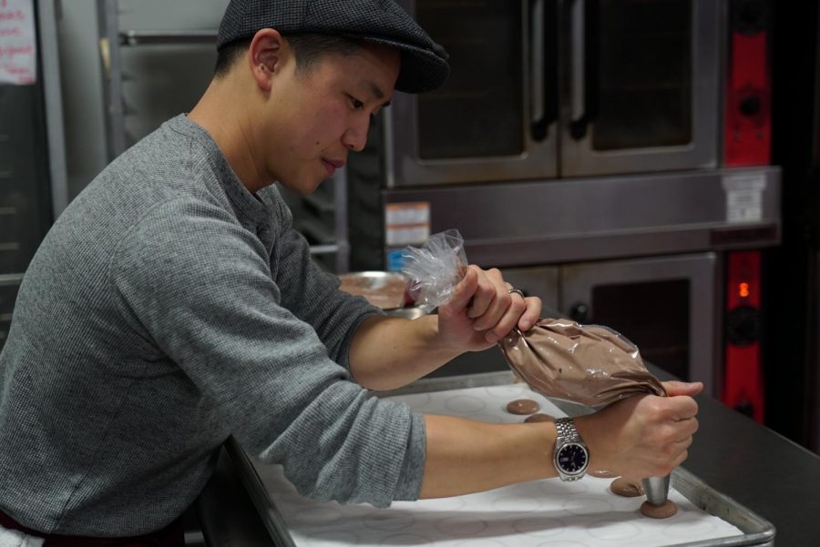 Independent business owner and DVC alumnus Evan B. Lowe prepares his own personal recipe for macaroons. (Ethan Anderson/The Inquirer)                               