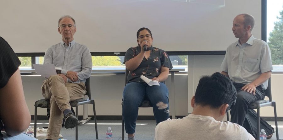 Soledad Castillo (center) tells her story about making it to the United States alongside Stephen Mayers (left) and Jonathan Freedman (right) in the Diablo Room on Sept. 25. (Emma Hall/The Inquirer).