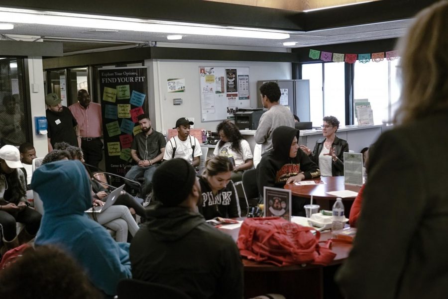 Students+and+faculty+meet+in+the+PUMA+Center+to+address+recent+racist+graffiti.