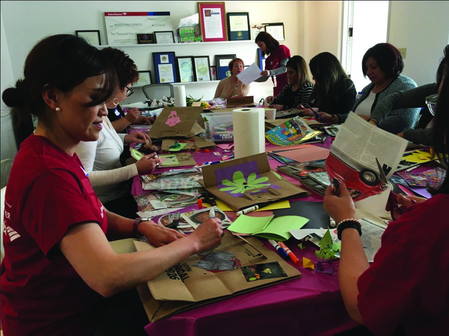 Volunteers of White Pony Express making cards for the holidays. (Photo courtesy of White Pony Express)