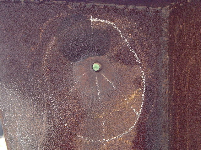 Bullet hole in a sculpture by Don Drumm| caused by a .30-06 round fired by the Ohio National Guard at Kent State on May 4, 1970. (Photo by M. Stewart)