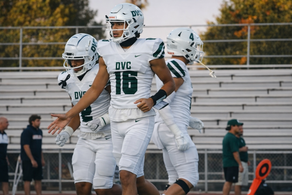 Diablo Valley College quarterback Joey Aguilar (16) high-fives teammates during a game in Pleasant Hill, Calif. (Photo courtesy of DVC Athletics)
